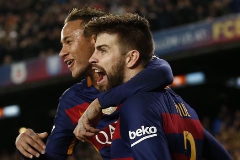 FC Barcelona's Gerard Pique, right, celebrates with his teammate Neymar after scoring against Athletic Bilbao during a quarterfinal, second leg, Copa del Rey soccer match at the Camp Nou stadium in Barcelona, Spain, Wednesday, Jan. 27, 2016. (AP Photo/Manu Fernandez)