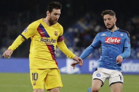 Barcelona's Lionel Messi, left, and Napoli's Dries Mertens challenge for the ball during the Champions League, Round of 16, first-leg soccer match between Napoli and Barcelona, at the San Paolo Stadium in Naples, Italy, Tuesday, Feb. 25, 2020. (AP Photo/Andrew Medichini)