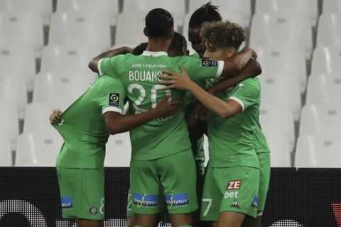 Saint-Etienne's Romain Hamouma celebrates with his teammates after scoring his side's opening goal during the French League One soccer match between Marseille and Saint Etienne at the Stade Velodrome in Marseille, France, Thursday, Sept.17, 2020. (AP Photo/Daniel Cole)