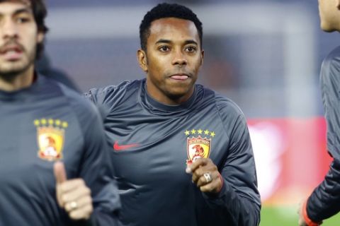 China's Guangzhou Evergrande FCs Robinho, center, and Goulart, left, of Brazil work out during a practice session in Yokohama, near Tokyo, Wednesday, Dec. 16, 2015. The Chinese club team will face against the FC Barcelona of Spain in the Club World Cup semi-final match in Yokohama Thursday, Dec. 17. (AP Photo/Shizuo Kambayashi)  