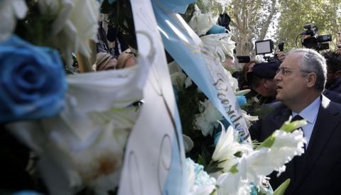 Lazio soccer team president Claudio Lotito lays a wreath outside Rome's Synagogue, Tuesday, Oct. 24, 2017. Lazio fans have a long history of racism and anti-Semitism and the Roman club's supporters established another low over the weekend when they littered the Stadio Olimpico with superimposed images of Anne Frank _ the young diarist who died in the Holocaust _ wearing a jersey of city rival Roma. (AP Photo/Gregorio Borgia)