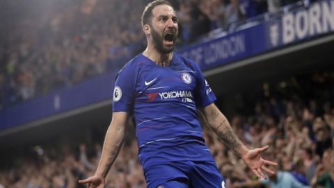 Chelsea's Gonzalo Higuain celebrates scoring his side's second goal during the English Premier League soccer match between Chelsea and Burnley at Stamford Bridge stadium in London, Monday, April 22, 2019. (AP Photo/Kirsty Wigglesworth)