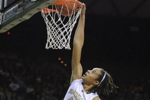 Baylor's Brittney Griner (42) dunks over Jacksonville State's Candice Carmine (23) during the first half of an NCAA college basketball game Tuesday, Nov. 24, 2009 in Waco, Texas. (AP Photo/Rod Aydelotte)