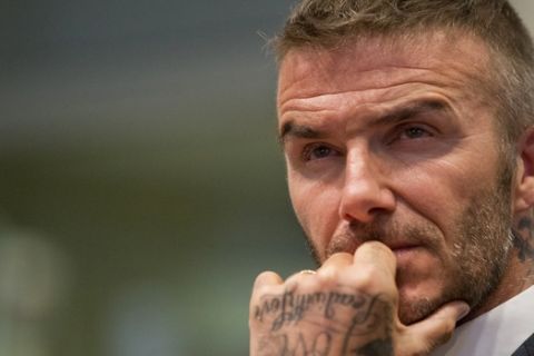 David Beckham listens during a public hearing for his proposed Major League Soccer stadium and commercial development, Thursday, July 12, 2018, at City Hall in Miami. (AP Photo/Wilfredo Lee)