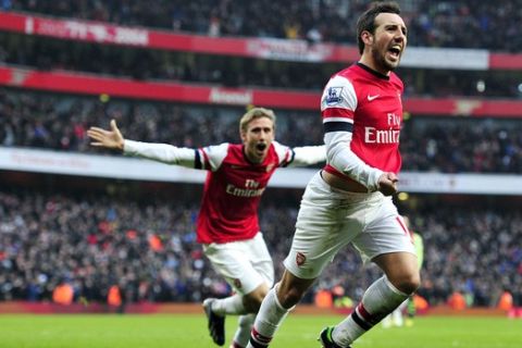 Arsenal's Spanish midfielder Santi Cazorla celebrates scoring the second goal during the English Premier League football match between Arsenal and Aston Villa at the Emirates Stadium in London on February 23, 2013. AFP PHOTO/GLYN KIRK.
