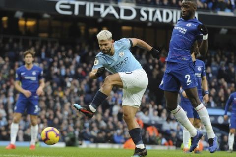 Manchester City's Sergio Aguero scores his side's third goal during the English Premier League soccer match between Manchester City and Chelsea at Etihad stadium in Manchester, England, Sunday, Feb. 10, 2019. (AP Photo/Rui Vieira)