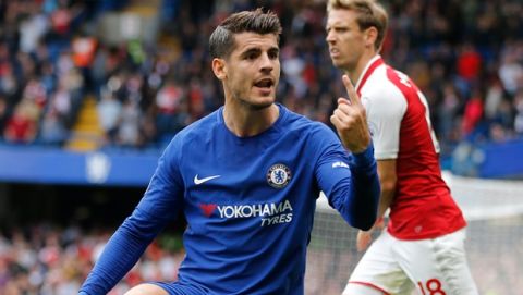 Chelsea's Alvaro Morata gestures after a tackle by Arsenal's Nacho Monreal, rear, during the English Premier League soccer match between Chelsea and Arsenal at Stamford Bridge stadium in London, Sunday, Sept. 17, 2017. (AP Photo/Frank Augstein)