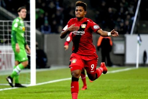 Leverkusen's Leon Bailey, right, celebrates his opening goal during the German soccer cup match between Borussia Moenchengladbach and Bayer Leverkusen in Moenchengladbach, Germany, Wednesday, Dec. 20, 2017. (AP Photo/Martin Meissner)