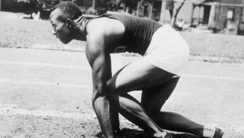 Sprinter Jesse Owens demonstrates the old "crouch" starting position in Cleveland, Ohio, July 30, 1935. Owens is working on new "standing" start position, which was suggested to him by his former high school coach Charlie Riley. The new starting style has shaved 1/5 of a second from his time for the first 20 yards. Owens hopes replacing the old "crouch" type start will enable him to run 100 yards in nine seconds flat. (AP Photo)