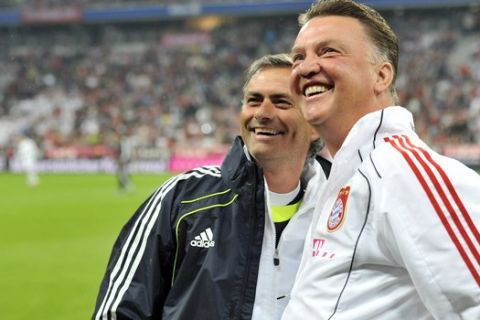 Munich's head coach Louis van Gaal, right, and Madrid's head coach Jose Mourinho looks on prior to their international friendly soccer match between FC Bayern Munich and  Real Madrid in Munich, southern Germany, Friday, Aug. 13, 2010. Fully 33 years later the farewell match will honor Franz Beckenbauer, who never received the honor when he left Munich to join the New York Cosmos, and later Hamburger SV. (AP Photo/Kerstin Joensson)