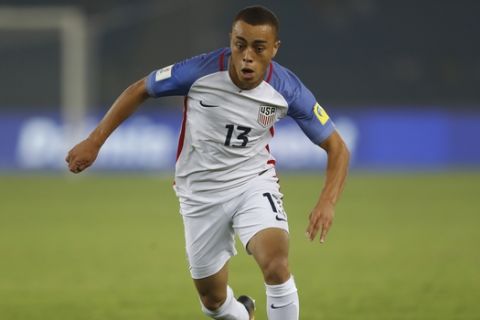 FILE - In this Monday, Oct. 16, 2017 file photo, Sergino Dest of the U.S controls the ball during the FIFA U-17 World Cup match against Paraguay in New Delhi, India. Ajax right back Sergino Dest has pledged his international future to the United States. The 18-year-old, who has a Surinamese-American father and Dutch mother, put an end Monday, Oct 28, 2019 to intense speculation about whether he would choose to play for the United States or the Netherlands, his country of birth.  (AP Photo/Tsering Topgyal)