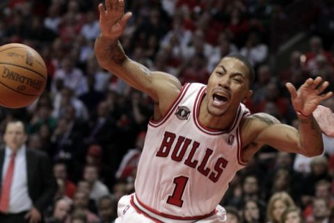 The Chicago Bulls' Derrick Rose reacts to being charged with an offensive foul during the first half of Game 5 of their NBA Eastern Conference first round playoff basket ball game in Chicago, April 26, 2011. REUTERS/John Gress (UNITED STATES - Tags: SPORT BASKETBALL)