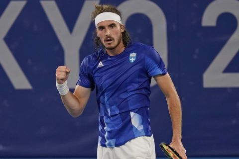 Stefanos Tsitsipas, of Greece, reacts during his match against Frances Tiafoe, of the United States, during the second round of the tennis competition at the 2020 Summer Olympics, Tuesday, July 27, 2021, in Tokyo, Japan. (AP Photo/Seth Wenig)
