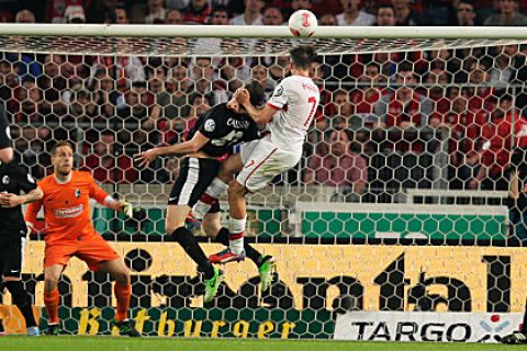 STUTTGART, GERMANY - APRIL 17:  Martin Harnik (C) of Stuttgart scores his team's second goal during the DFB Cup Semi Final match between VfB Stuttgart and SC Freiburg at Mercedes-Benz Arena on April 17, 2013 in Stuttgart, Germany.  (Photo by Joern Pollex/Bongarts/Getty Images)