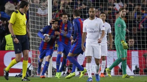 Barcelona's Lionel Messi, left, celebrates scoring his side's 2nd goal from a penalty during the Champions League round of 16, second leg soccer match between FC Barcelona and Paris Saint Germain at the Camp Nou stadium in Barcelona, Spain, Wednesday March 8, 2017. (AP Photo/Manu Fernandez)