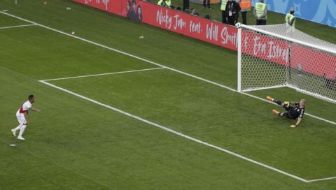 Peru's Christian Cueva, left, fails to score on a penalty kick during the group C match between Peru and Denmark at the 2018 soccer World Cup in the Mordovia Arena in Saransk, Russia, Saturday, June 16, 2018. (AP Photo/Gregorio Borgia)