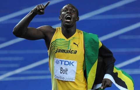 USAIN BOLT (JAMAICA) CELEBRATES AFTER WINNING 100 METERS FINAL ON THE OLYMPIC STADION ( OLIMPIASTADION ) DURING 12TH IAAF WORLD CHAMPIONSHIPS IN ATHLETICS BERLIN 2009.JAMAICAN USAIN BOLT SET A NEW WORLD RECORD OF 9.58 SECONDS...BERLIN , GERMANY , AUGUST 16, 2009..( PHOTO BY ADAM NURKIEWICZ / MEDIASPORT )