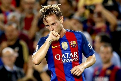 FC Barcelona's Ivan Rakitic reacts after scoring a goal during the Spanish La Liga soccer match between FC Barcelona and Atletico Madrid at the Camp Nou in Barcelona, Spain, Wednesday, Sept. 21, 2016. (AP Photo/Manu Fernandez)