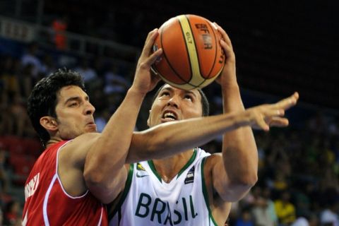 Joao Batista (R) of Brazil vies with Mohamed Ghyaza (L) of Tunisia during the preliminary round group B match between Brazil and Tunusia, at the FIBA World Basketball Championships at the Abdi Ipekci Arena in Istanbul, on August 29, 2010. AFP PHOTO / MUSTAFA OZER (Photo credit should read MUSTAFA OZER/AFP/Getty Images)
