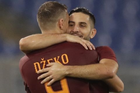 Romas Kostas Manolas, right, celebrates with teammate Edin Dzeko after scoring, during a Serie A soccer match between Roma and Inter Milan, at Rome's Olympic Stadium, Sunday, Oct. 2, 2016. (AP Photo/Andrew Medichini)