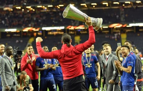 United's Zlatan Ibrahimovic holds the trophy after winning the soccer Europa League final between Ajax Amsterdam and Manchester United at the Friends Arena in Stockholm, Sweden, Wednesday, May 24, 2017. United won 2-0. (AP Photo/Martin Meissner)