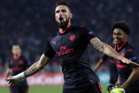 Arsenal's Olivier Giroud celebrates scoring his side's first goal of the game during the Europa League group H soccer match between Red Star and Arsenal on the stadium Rajko Mitic in Belgrade, Serbia, Thursday, Oct. 19, 2017. (AP Photo/Darko Vojinovic)