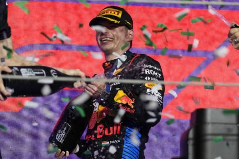 Red Bull driver Max Verstappen of the Netherlands celebrates on the podium after winning the Formula One Saudi Arabian Grand Prix at the Jeddah Corniche Circuit, in Jedda, Saudi Arabia, Saturday, March 9, 2024. (AP Photo/Darko Bandic)