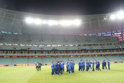 Italy's national soccer team players arrive for a training session at the Olympic stadium in Baku, Azerbaijan, Friday, Oct. 9, 2015. Italy will play Azerbaijan in a Euro 2016 soccer qualifying group H match on Saturday, Oct. 10 in Baku. (AP Photo/Mindaugas Kulbis)