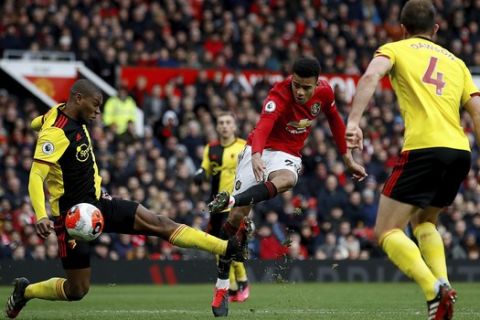 Manchester United's Mason Greenwood scores against Watford during the English Premier League soccer match at Old Trafford, Manchester, England, Sunday Feb. 23, 2020. (Martin Rickett/PA via AP)