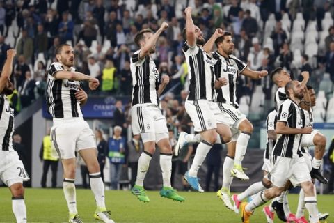 Juventus players celebrate their 3-0 win, at the end of a Champions League, quarterfinal, first-leg soccer match between Juventus and Barcelona, at the Juventus Stadium in Turin, Italy, Tuesday, April 11, 2017. Juventus won 3-0. (AP Photo/Antonio Calanni)