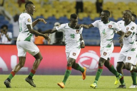 Guinea Bissau's Piqueti Djassi Brito E Silva, second right, celebrates scoring against Cameroon with teammates during the African Cup of Nations Group A soccer match between Cameroon and Guinea Bissau at the Stade de l'Amitie, in Libreville, Gabon on Wednesday Jan. 18, 2017. (AP Photo/Sunday Alamba)