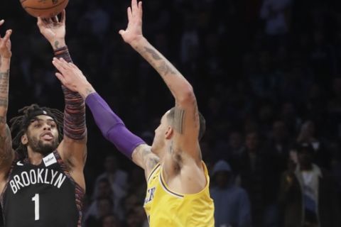 Brooklyn Nets' D'Angelo Russell (1) shoots over Los Angeles Lakers' Kyle Kuzma (0) during the second half of an NBA basketball game Tuesday, Dec. 18, 2018, in New York. The Nets won 115-110. (AP Photo/Frank Franklin II)