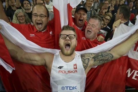 Poland's Pawel Fajdek celebrates after winning the men's hammer throw final during the World Athletics Championships in London Friday, Aug. 11, 2017. (AP Photo/Tim Ireland)