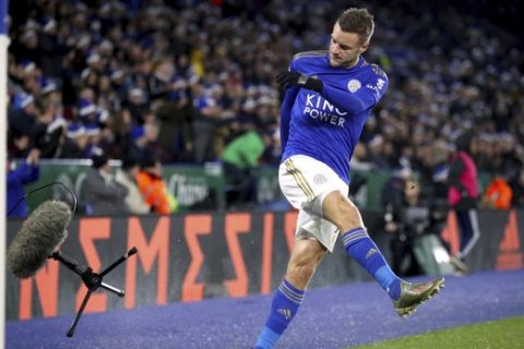 Leicester City's Jamie Vardy kicks a pitch-side microphone during the match against Norwich City, during their English Premier League soccer match at King Power Stadium in Leicester, England, Saturday Dec. 14, 2019. (Nick Potts/PA via AP)