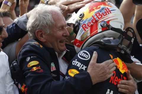 Red Bull driver Max Verstappen, of the Netherlands, right, celebrates with Helmut Marko, of his team during the Brazilian Formula One Grand Prix at the Interlagos race track in Sao Paulo, Brazil, Sunday, Nov. 17, 2019. (AP Photo/Nelson Antoine)