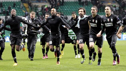 Juventus's players celebrate after a 3-0 victory against Celtic during the UEFA Champions League last sixteen football match between Celtic and Juventus at Celtic park in Glasgow, Scotland, on February 12, 2013. AFP PHOTO/GRAHAM STUART        (Photo credit should read GRAHAM STUART/AFP/Getty Images)