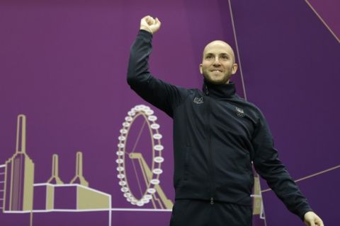 Italy's Niccolo Campriani celebrates winning the silver medal in the men's 10-meter air rifle at the 2012 Summer Olympics, Monday, July 30, 2012, in London. (AP Photo/Rebecca Blackwell)