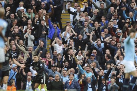 Manchester City fans celebrate Manchester City's Bernardo Silva goal during the English Premier League soccer match between Manchester City and Burnley at Etihad stadium in Manchester, England, Saturday, Oct. 20, 2018. (AP Photo/Rui Vieira)