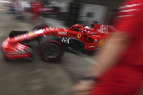 Ferrari driver Sebastian Vettel of Germany pulls out from the garage for the third practice at the Suzuka Circuit ahead of the Japanese Formula One Grand Prix in Suzuka, central Japan Saturday, Oct. 6, 2018.(AP Photo/Ng Han Guan)
