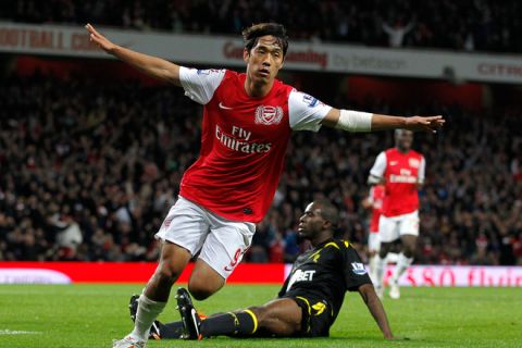 Arsenal's South Korean player Ju Young Park celebrates scoring a goal against  Bolton Wanderers during a league cup fourth round football match at The Emirates Stadium in London on October 25, 2011. AFP PHOTO/IAN KINGTON

RESTRICTED TO EDITORIAL USE. No use with unauthorised audio, video, data, fixture lists, club/league logos or âliveâ services. Online in-match use limited to 45 images, no video emulation. No use in betting, games or single club/league/player publications. (Photo credit should read IAN KINGTON/AFP/Getty Images)