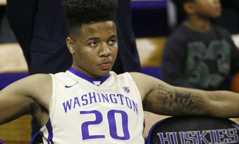 Washington guard Markelle Fultz sits on the bench before being introduced at the start of an NCAA college basketball game against Arizona State, Thursday, Feb. 16, 2017, in Seattle. (AP Photo/Ted S. Warren)