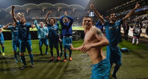 Zenit's players celebrate after winning an UEFA Champions League Group H football match between Lyon and Zenit Saint-Petersburg at the Stade de Gerland stadium in Lyon, southeastern France on November 4, 2015. AFP PHOTO / PHILIPPE DESMAZES        (Photo credit should read PHILIPPE DESMAZES/AFP/Getty Images)