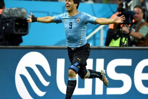 SAO PAULO, BRAZIL - JUNE 19:  Luis Suarez of Uruguay celebrates scoring his team's second goal during the 2014 FIFA World Cup Brazil Group D match between Uruguay and England at Arena de Sao Paulo on June 19, 2014 in Sao Paulo, Brazil.  (Photo by Mike Hewitt - FIFA/FIFA via Getty Images)