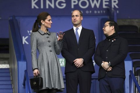 Leicester City Vice chairman Aiyawatt Srivaddhanaprabha, the son of deceased owner Vichai Srivaddhanaprabha, right, talks with Britain's Prince William and Kate, Duchess The Duke of Cambridge, as they view the pitch from the stands at Leicester City Football Club's King Power Stadium in Leicester, England, Wednesday, Nov. 28, 2018. Srivaddhanaprabha, the Thai billionaire owner of Premier League team Leicester City was among five people who died after his helicopter crashed and burst into flames shortly after taking off from the soccer field on Saturday Oct. 27, 2018. (Aaron Chown/PA via AP)