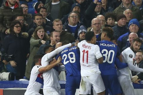 Everton, in blue, and Lyon players clash during a Group E Europa League soccer match between Everton F.C. and Olympique Lyon at Goodison Park Stadium, Liverpool, England, Thursday Oct. 19, 2017. (AP Photo/Dave Thompson)