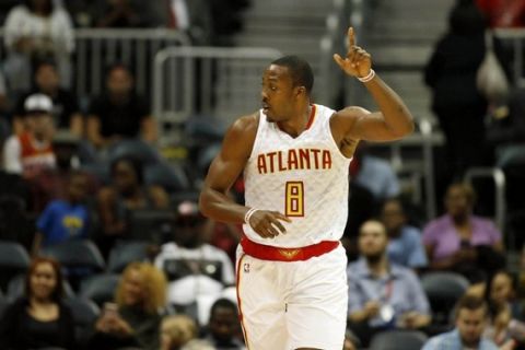Oct 18, 2016; Atlanta, GA, USA; Atlanta Hawks center Dwight Howard (8) celebrates a play in the first quarter of their game against the New Orleans Pelicans at Philips Arena. Mandatory Credit: Jason Getz-USA TODAY Sports