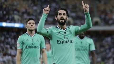 Real Madrid's Isco celebrates after scoring the second goal during the Spanish Super Cup semifinal soccer match between Real Madrid and Valencia at King Abdullah stadium in Jiddah, Saudi Arabia, Thursday, Jan. 9, 2020. (AP Photo/Amr Nabil)