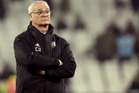 FILE - In this Friday, Feb. 22, 2019 file photo, Fulham manager Claudio Ranieri watches the warm up ahead of the English Premier League soccer match between West Ham and Fulham at the London Stadium in London. Roma has appointed Claudio Ranieri as interim coach until the end of the season to replace Eusebio Di Francesco, who it fired following the Italian team's elimination from the Champions League. The 67-year-old Ranieri flew into Rome on Friday and signed a contract until June 30. It will be the Rome-born Ranieri's second spell as coach of the capital club, having previously been in charge from 2009-2011. Ranieri says: Im delighted to be coming back home. When Roma call you, its impossible to say no. (AP Photo/Matt Dunham, File )