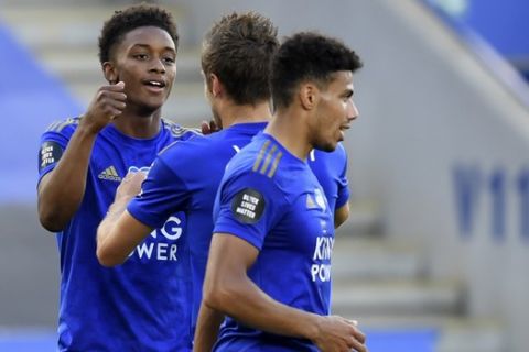 Leicester's Demarai Gray, left, celebrates with teammates after scoring his side's second goal during the English Premier League soccer match between Leicester City and Sheffield United at the King Power Stadium, in Leicester, England, Thursday, July 16, 2020. (Michael Regan/Pool via AP)