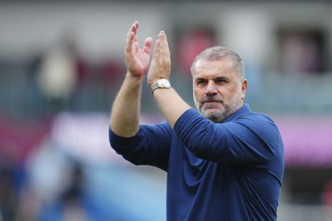 Tottenham's head coach Ange Postecoglou applaud supporters at the end of the English Premier League soccer match between Burnley and Tottenham Hotspur at Turf Moor stadium in Burnley, England, Saturday, Sept. 2, 2023. (AP Photo/Jon Super)